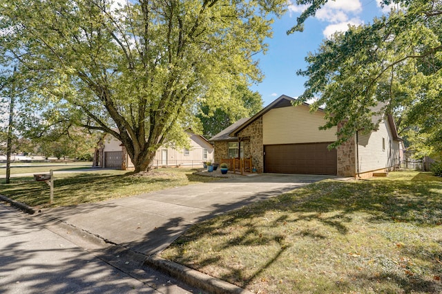 view of front of house with a front yard and a garage