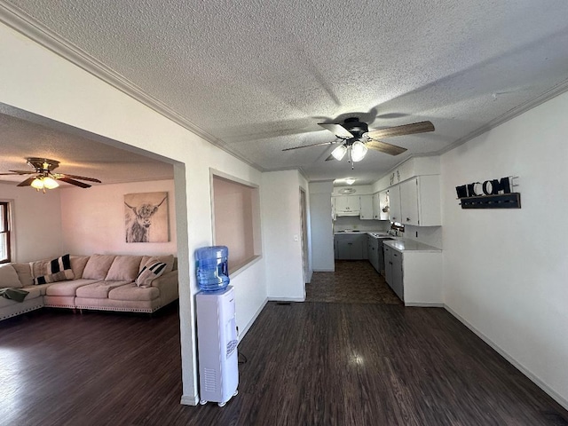 kitchen featuring dark hardwood / wood-style floors, white cabinets, ornamental molding, white electric range oven, and ceiling fan