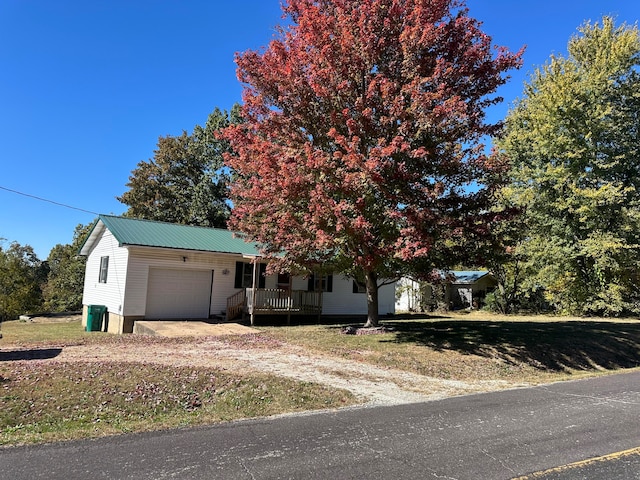 obstructed view of property with a garage