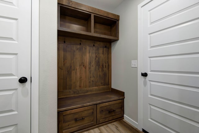 mudroom with light hardwood / wood-style floors