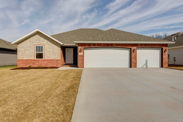 ranch-style house with a garage and a front lawn