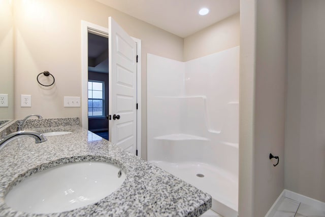 bathroom with vanity and walk in shower