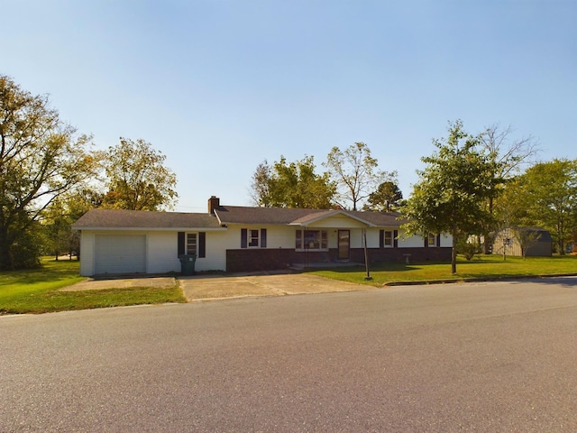 single story home with a front yard and a garage