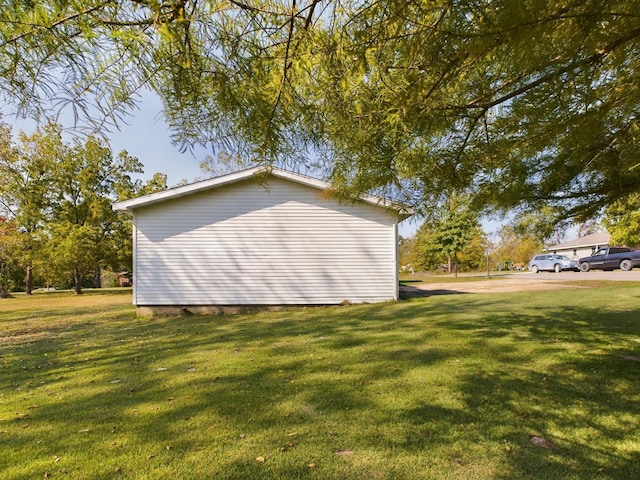 view of property exterior featuring a lawn