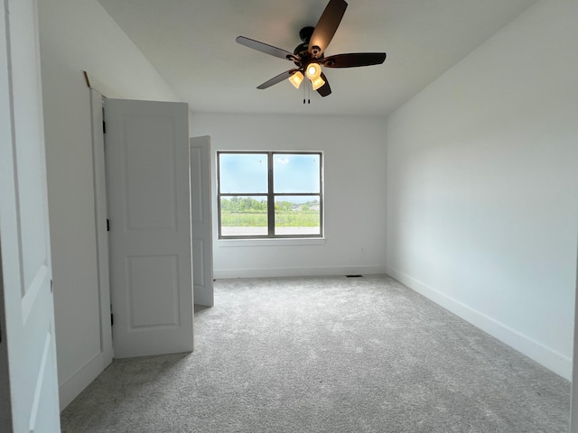 carpeted empty room with ceiling fan