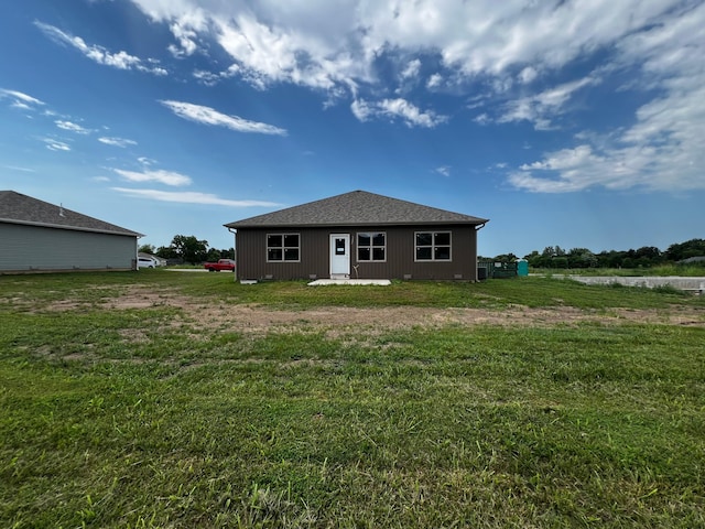 back of house with a yard