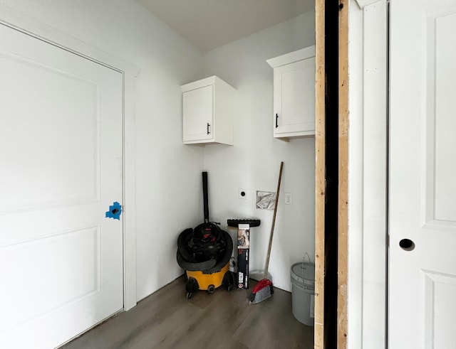 laundry area featuring hookup for an electric dryer and dark hardwood / wood-style floors