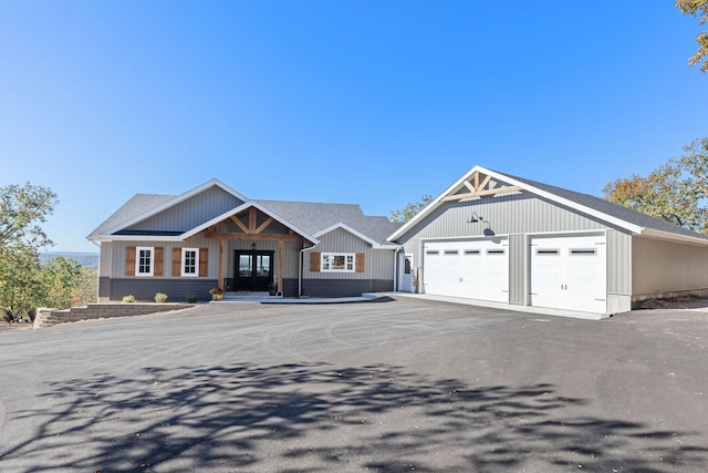 view of front of property featuring french doors and a garage