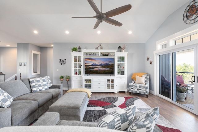 living room featuring vaulted ceiling, ceiling fan, and dark hardwood / wood-style floors