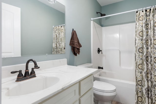 full bathroom featuring vanity, toilet, and shower / bath combo with shower curtain