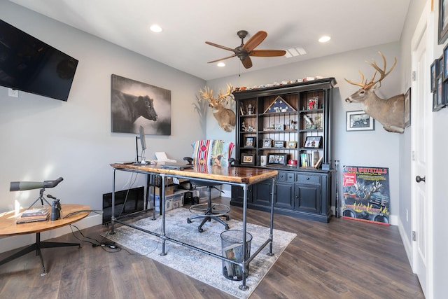 home office with dark hardwood / wood-style flooring and ceiling fan