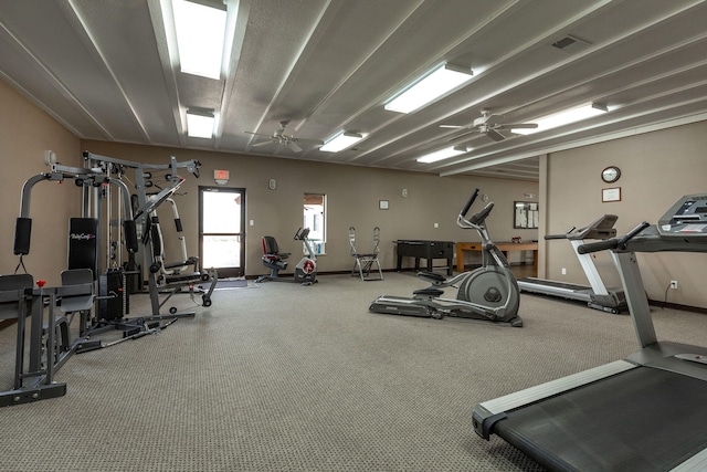 gym featuring ceiling fan and carpet floors