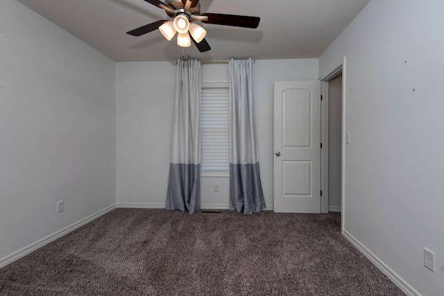 carpeted empty room with ceiling fan