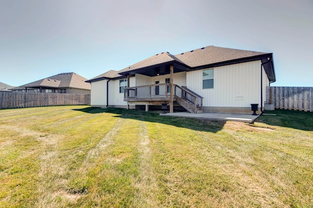 rear view of house with a lawn