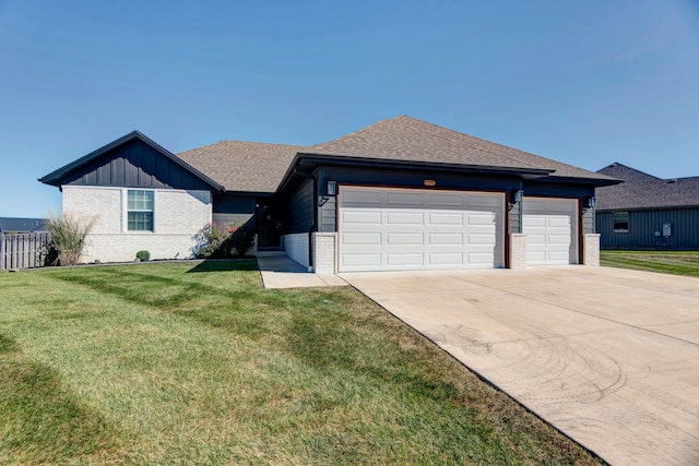 view of front facade with a front lawn and a garage