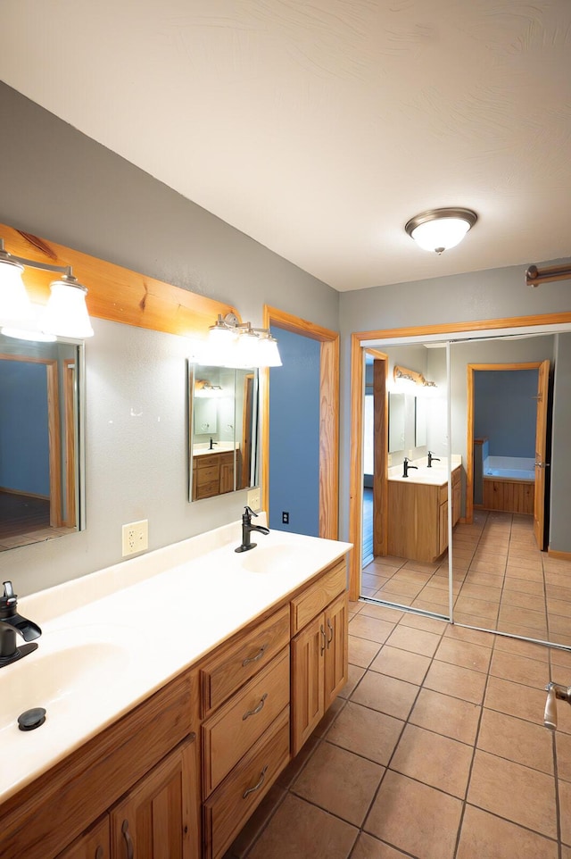21620 County Road 232, Hermitage, MO 65668 - full bath featuring tile patterned floors, a sink, and double vanity