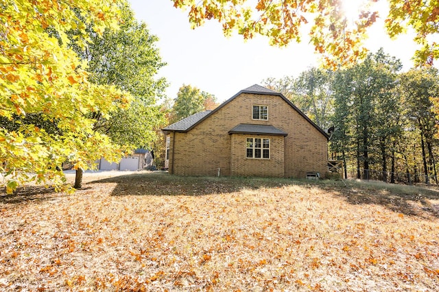21620 County Road 232, Hermitage, MO 65668 - view of home's exterior with brick siding and fence