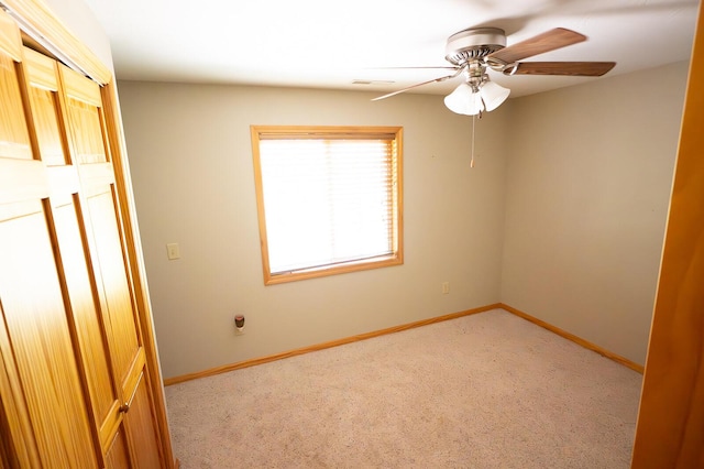 21620 County Road 232, Hermitage, MO 65668 - unfurnished bedroom featuring carpet, visible vents, baseboards, and ceiling fan