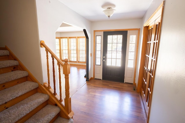 21620 County Road 232, Hermitage, MO 65668 - entryway with wood finished floors, arched walkways, and stairs