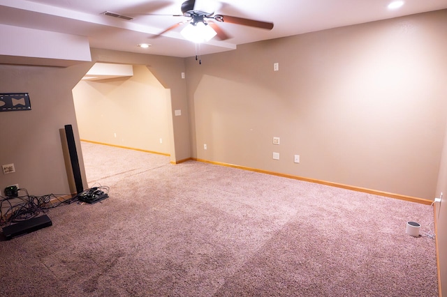 spare room featuring carpet flooring and ceiling fan