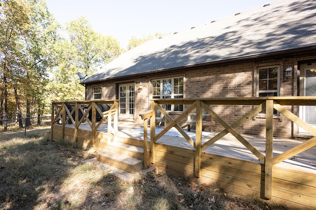 back of house featuring a wooden deck