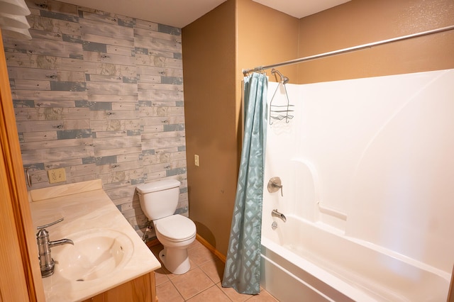 full bathroom featuring vanity, toilet, tile patterned floors, and shower / bathtub combination with curtain