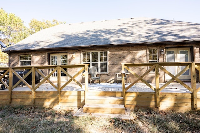 21620 County Road 232, Hermitage, MO 65668 - back of property featuring a wooden deck, a shingled roof, and brick siding