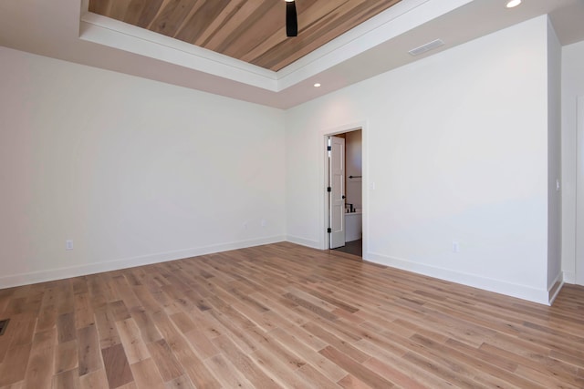 unfurnished room featuring light hardwood / wood-style floors, a tray ceiling, wood ceiling, and ceiling fan