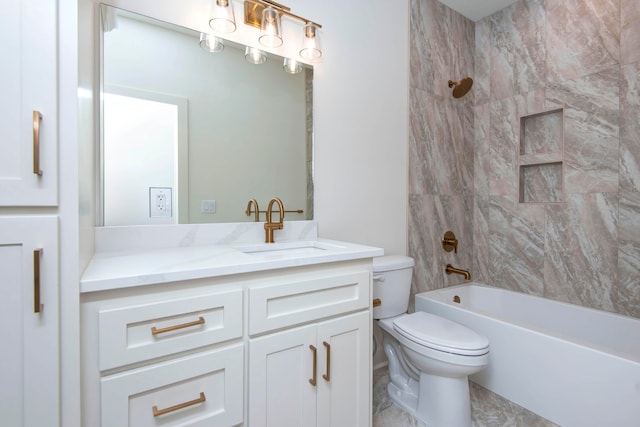 full bathroom with vanity, tiled shower / bath combo, and toilet