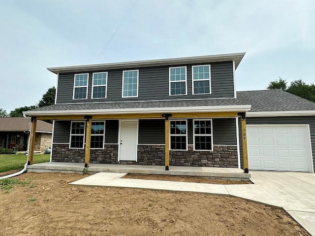 view of front of property featuring a porch and a garage