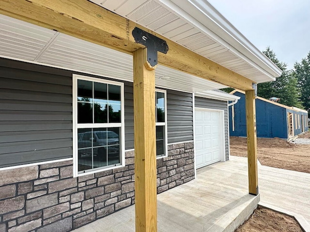 view of patio featuring a garage