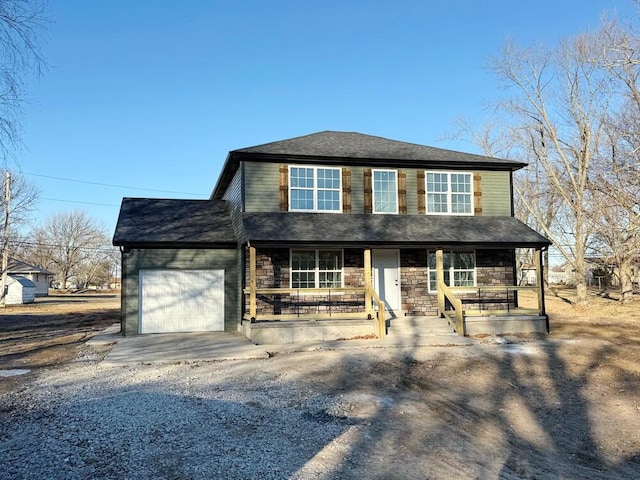 view of front of house featuring a garage and covered porch