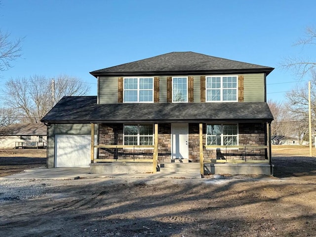 view of front of home featuring a garage and covered porch