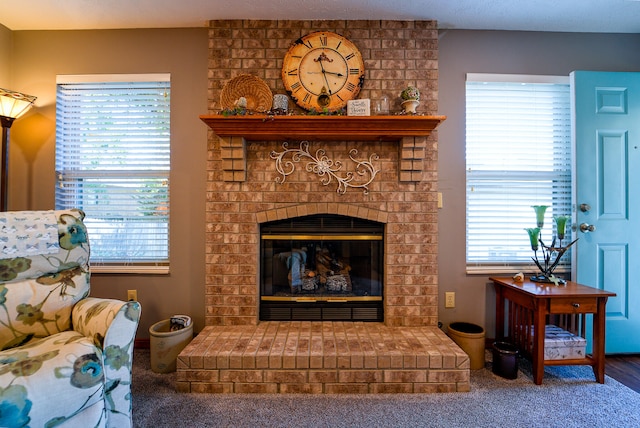 interior space featuring a wealth of natural light and a brick fireplace