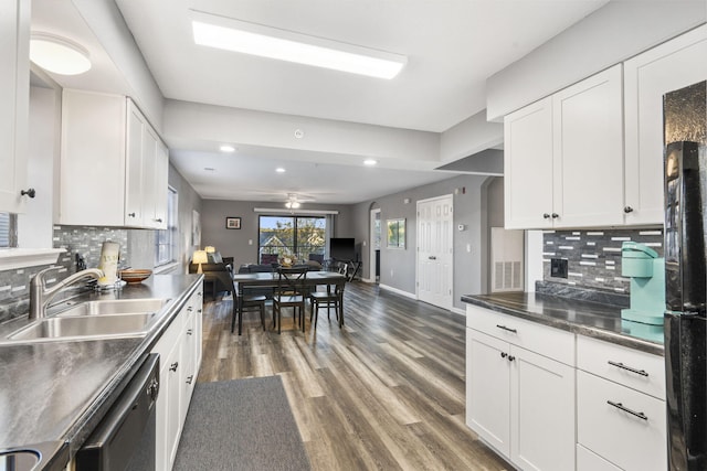 kitchen featuring white cabinetry, tasteful backsplash, and sink