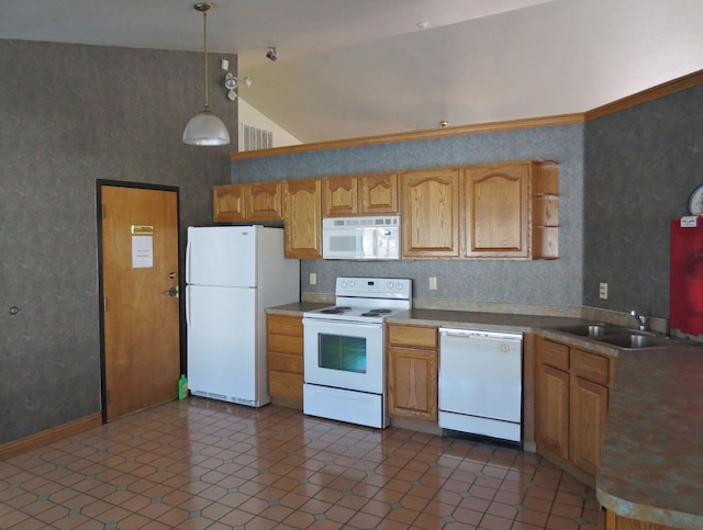 kitchen featuring white appliances, dark tile patterned flooring, sink, hanging light fixtures, and high vaulted ceiling