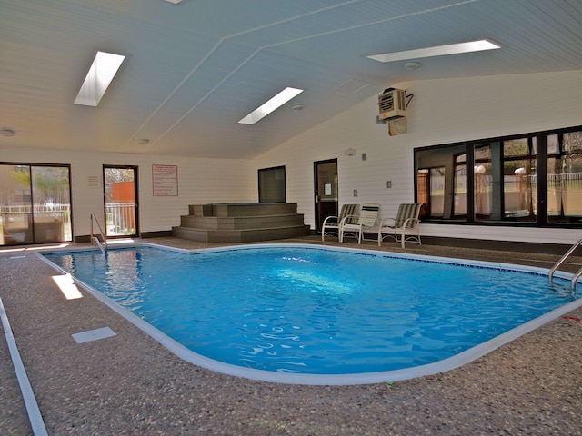 view of swimming pool featuring a skylight