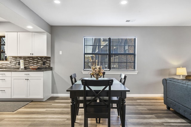 dining area featuring wood-type flooring