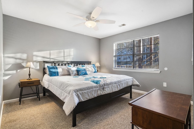 bedroom featuring ceiling fan and carpet