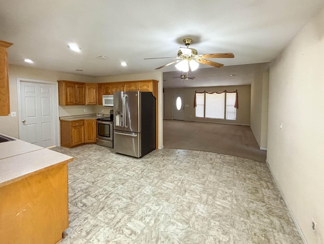 221 Beachwood St, Theodosia, MO 65761 - kitchen with stainless steel appliances, light floors, light countertops, a ceiling fan, and baseboards
