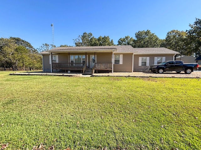 single story home with covered porch and a front lawn