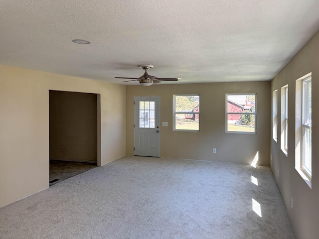 221 Beachwood St, Theodosia, MO 65761 - spare room with a ceiling fan, carpet floors, and a textured ceiling