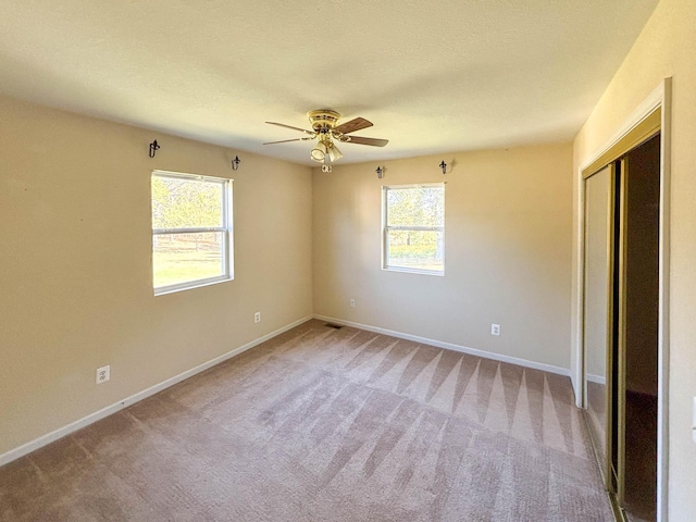 221 Beachwood St, Theodosia, MO 65761 - unfurnished bedroom with carpet floors, a closet, baseboards, and ceiling fan