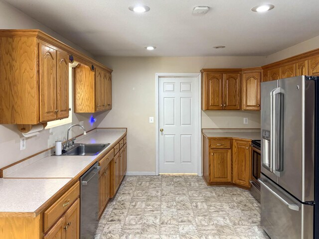 221 Beachwood St, Theodosia, MO 65761 - kitchen with brown cabinets, stainless steel appliances, light countertops, and a sink