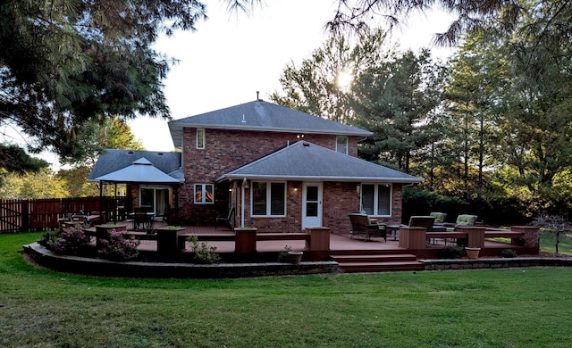 back of house with a yard and a deck