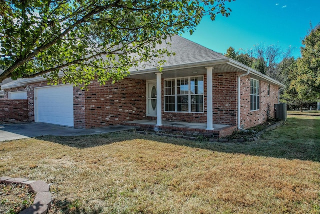 view of front of house with cooling unit, concrete driveway, brick siding, an attached garage, and a front yard
