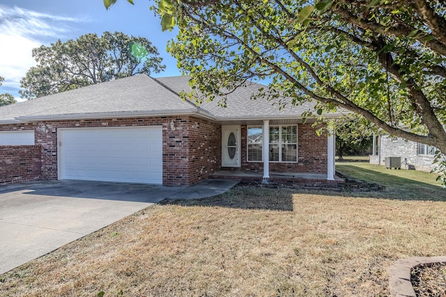 single story home featuring a garage, brick siding, driveway, and roof with shingles