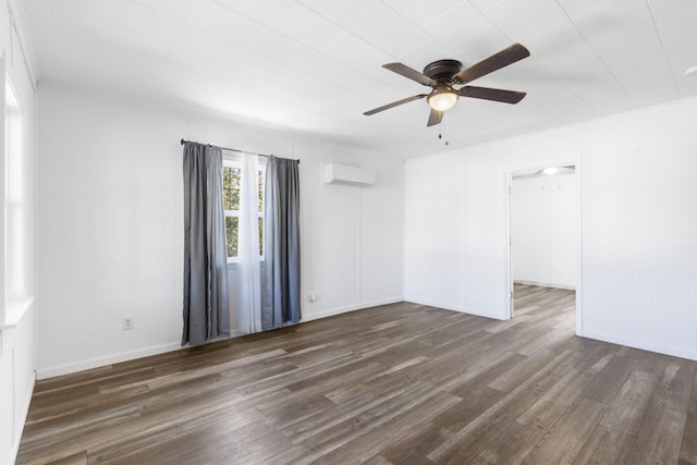 spare room featuring crown molding, a wall mounted AC, dark hardwood / wood-style floors, and ceiling fan