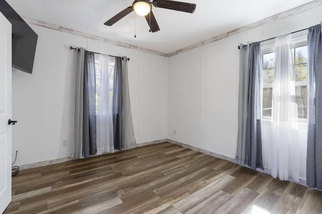 unfurnished room with hardwood / wood-style floors and ceiling fan