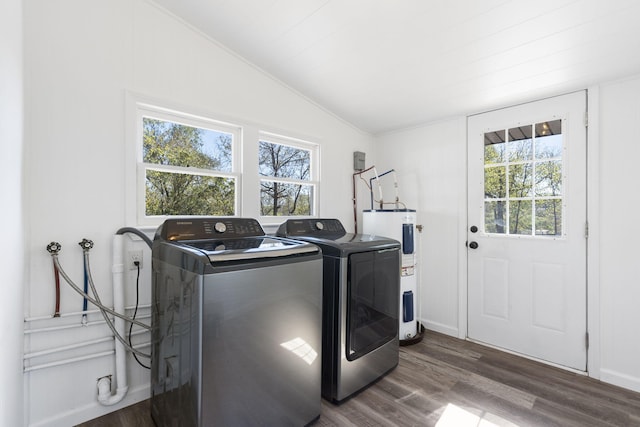 clothes washing area featuring a wealth of natural light, electric water heater, and dark hardwood / wood-style flooring